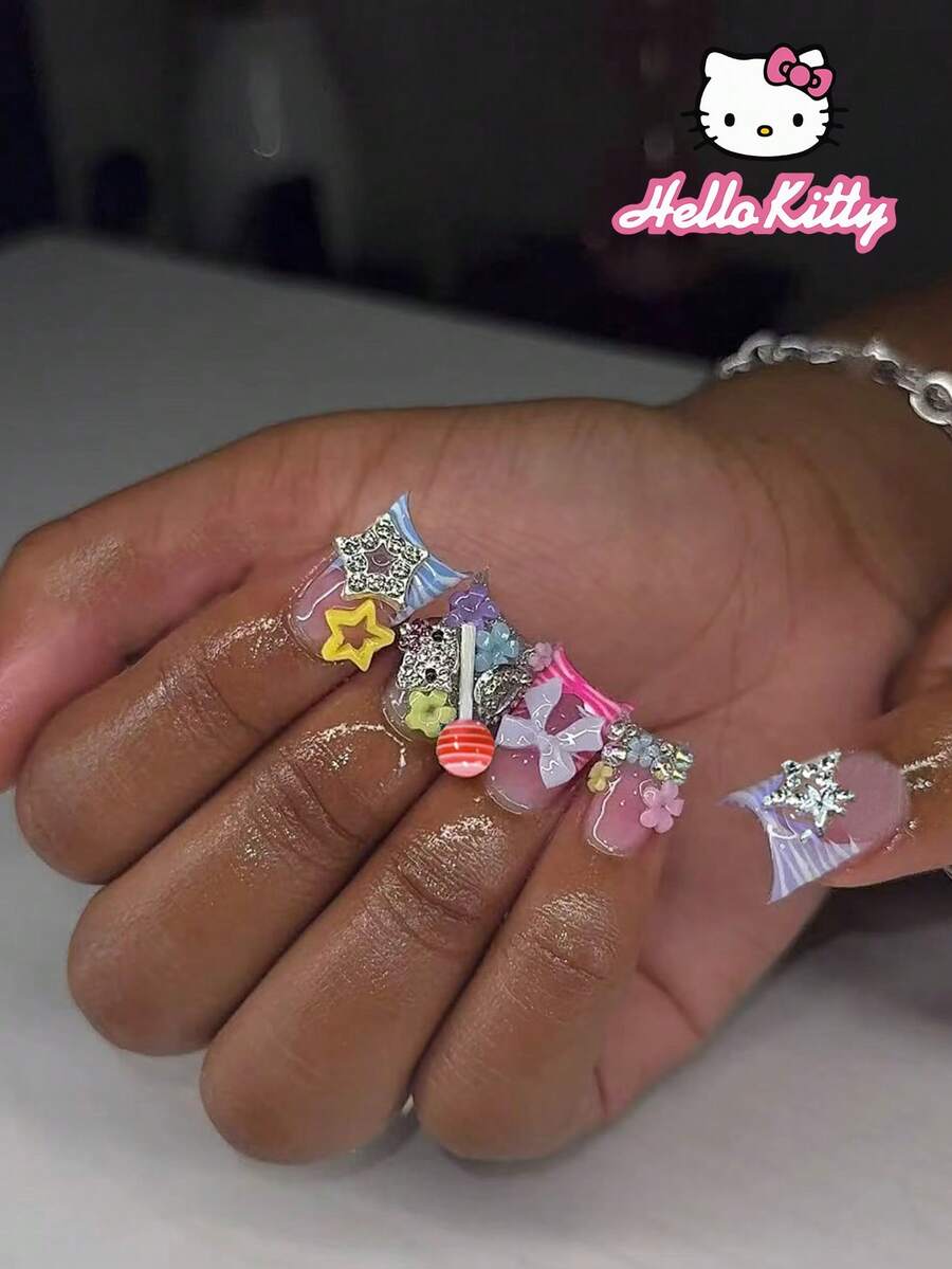 SANRIO Y2K 24片装中号鸭子豹纹粉色法式美甲贴片，饰有可爱3D粉色蝴蝶结、爱心、水钻星星、棒棒糖、水钻和花朵图案，彩虹色系，完美贴合假指甲套装，包含1片果冻胶和1个指甲锉，适合女性和女孩日常及派对使用。 - 彩色 - 查看 1