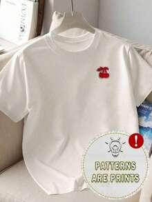Camiseta de verano holgada y adelgazante con estampado de cerezas para mujer, versátil, de cuello redondo y manga corta, agradable al tacto, transpirable, para uso diario y casual. - Blanco - Ver 1