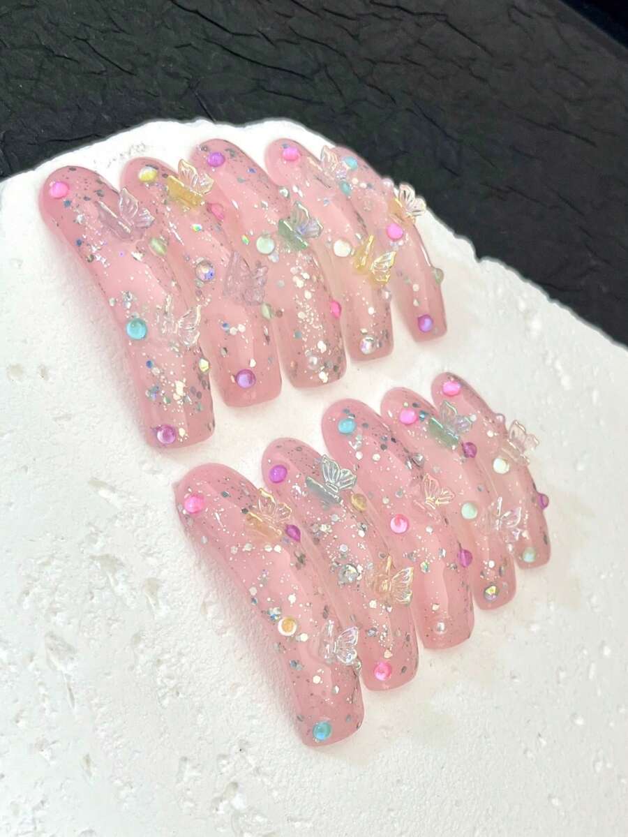 10片超长手工美甲贴片,适合派对和日常佩戴,3D水钻、花朵、蝴蝶结、小猫咪和芭蕾舞元素,适合女孩,易于佩戴。10片Y2K风格超长手工美甲贴片,闪亮人造宝石,春夏风格,适合女孩和女士参加节日派对和日常佩戴。(请注意:配饰颜色随机。如果您介意,我们建议您不要下单。)手工美甲贴片 - 淺粉色 - 查看 1