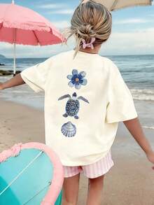 这款少女T恤印有海龟、贝壳和热带花卉图案，柔软舒适，适合女孩旅行、度假、户外运动、日常休闲穿着，是休闲旅行的最佳选择！时尚百搭的少女春夏休闲上衣。 - 杏色 - 查看 4