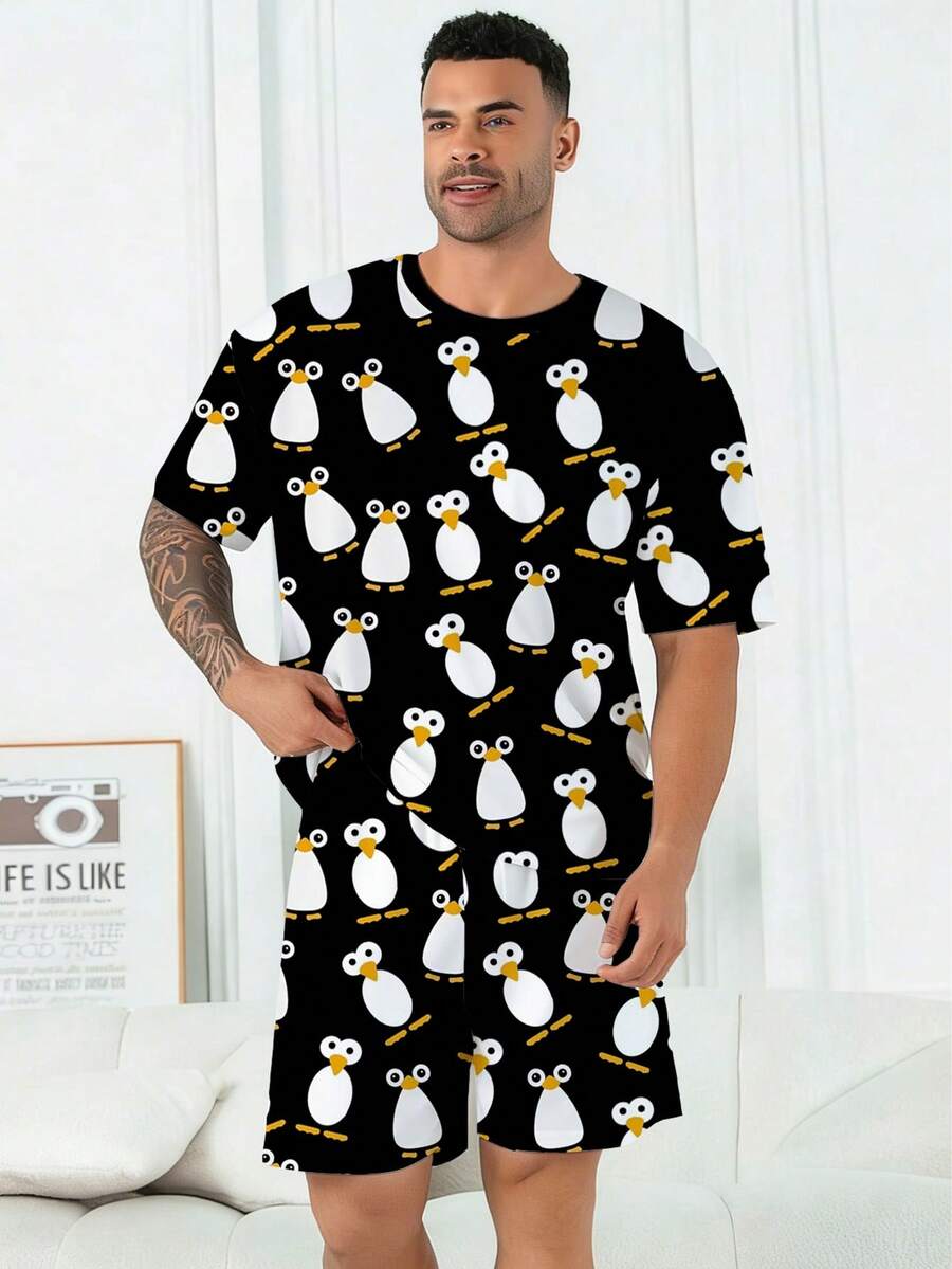 Conjunto de pijama para hombres talla grande | Parte superior de cuello redondo y manga corta, y pantalón corto casual con cintura elástica, conjunto de 2 piezas | Tela de punto de poliéster suave y transpirable, corte holgado | Diseño casual con estampado de pingüinos de ojos grandes - Negro - Ver 1