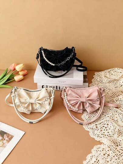 This 1pc Pu Zippered Shoulder Bag Features A Sweet Style With A Large Bow Embellishment And A Pearl Chain. It Boasts A Street Style And Is A Lightweight Crossbody Bag Suitable For Everyday Use, Including Outings, Dates, And More. It Also Makes An Ideal Holiday Gift For Friends.Festival Kareem
