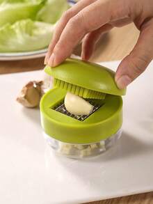 1件装重型蒜蓉压榨器/切碎器 - 手动压蒜切碎器，带易清洁切碎盘，紧凑型手持设计，塑料材质，可压蒜瓣（否） - 可用洗碗机清洗 - 彩色 - 查看 5
