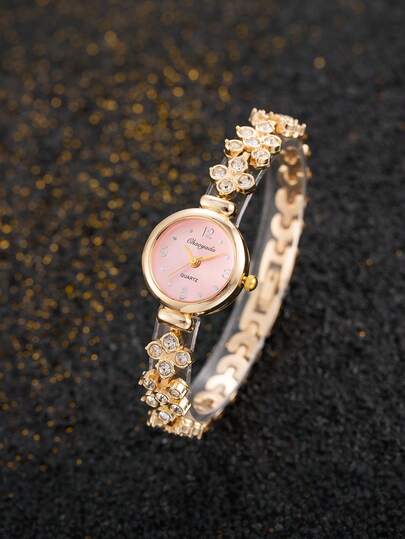 1件女士优雅金色和粉色金属合金表带腕表，饰有闪亮水钻花卉装饰，精美钻石镶嵌花朵链节，时尚甜美复古奢华风格，精准石英机芯模拟计时功能，女士正装腕表手镯表，时尚腕表，经典时计，适合日常休闲佩戴，宴会、办公、正式派对、度假，是周年纪念日、生日、情人节、节日特殊活动的完美礼物，送给女友、妻子、母亲、少女的理想之选。