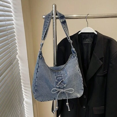 复古做旧浅蓝色帆布单肩包，女士款，系带装饰，拉链封口，适合日常户外四季使用