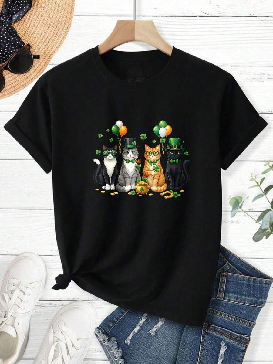 Men's T-Shirt, Women's T-Shirt, St Patrick's Day Themed Designs Featuring, Four Cats Wearing Green Hats And Bow Ties Standing With Balloons Shamrocks And A Pot Of Gold On A Black Shirt Background Comfortable And Versatile Outdoor Casual Short Sleeve - Negro - Ver 1