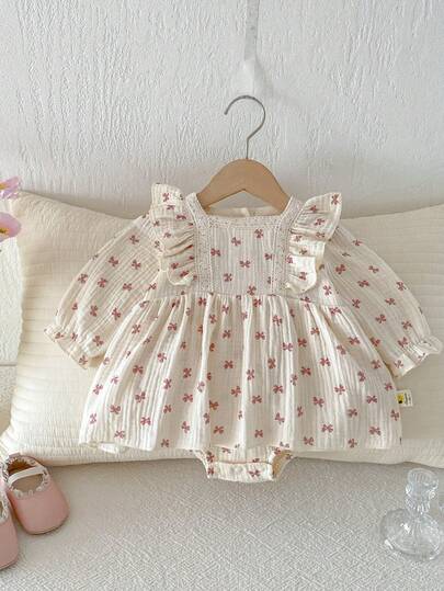 Đầm liền thân in nơ cho bé gái mùa xuân, dễ thương.