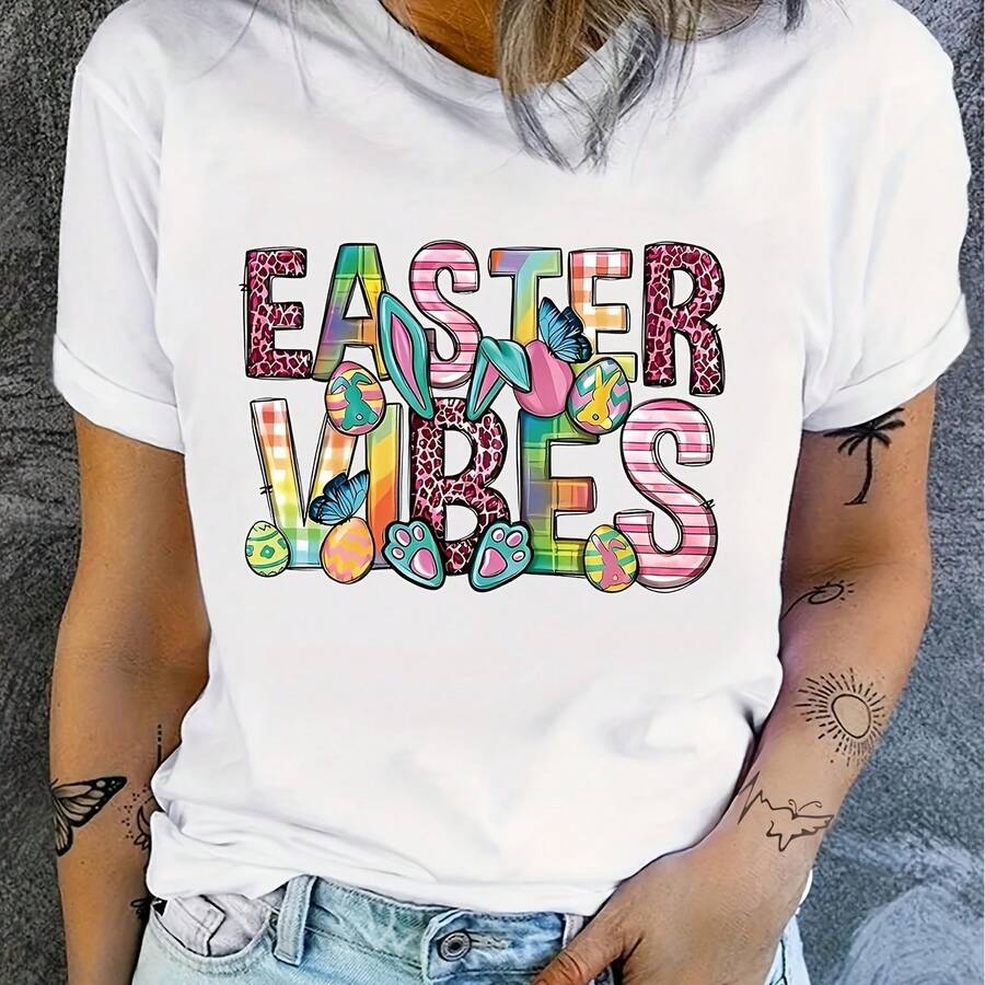 T-shirt imprimé graphique de Pâques pour grandes tailles - Top décontracté à col ras-du-cou et manches courtes avec un design vibrant aux couleurs de Pâques, œufs colorés et fleurs, coupe confortable et extensible, lavage machine, vêtements de printemps et d'été pour les fêtes, t-shirts pour femmes, tenue festive, design ludique, tissu durable - Blanc - Voir 1