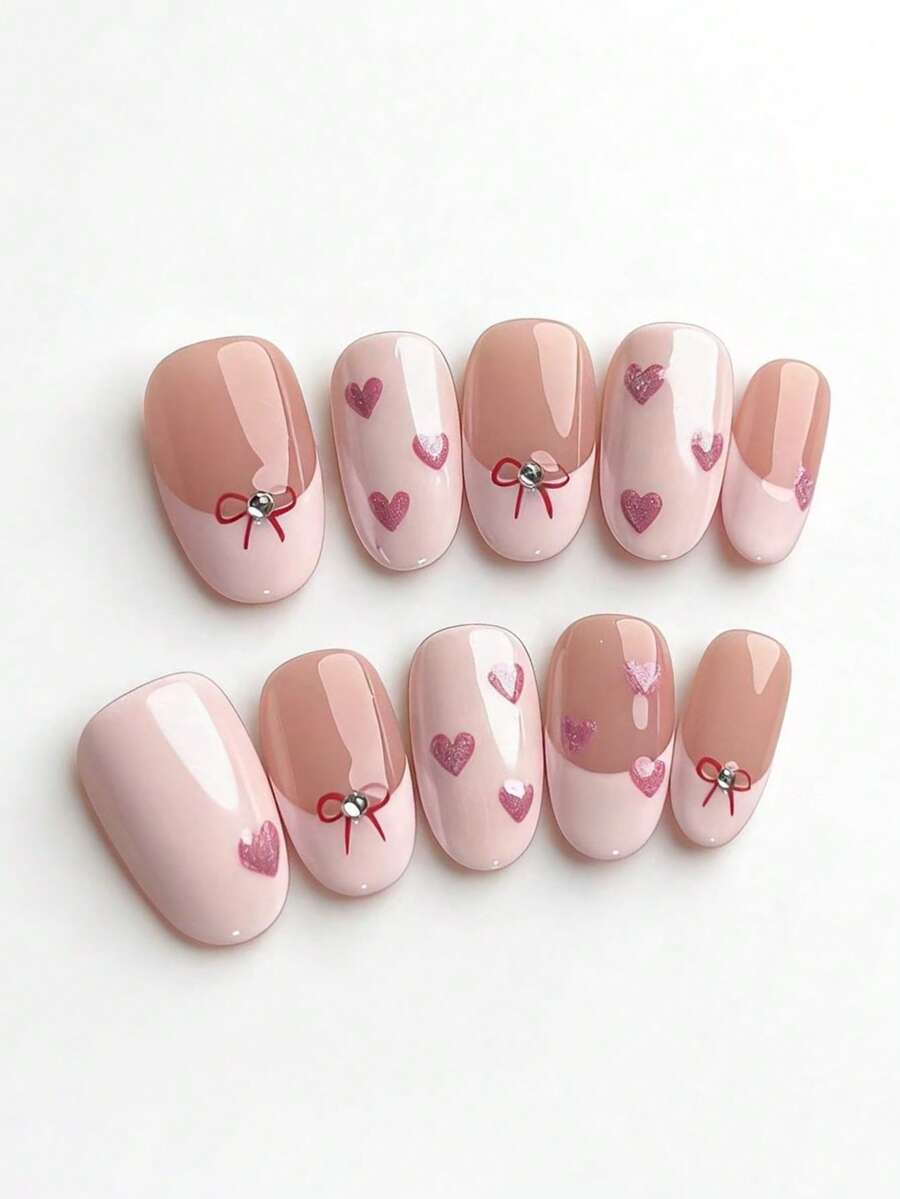 10片纯手工制作的短椭圆形粉色美甲贴片，饰有爱心和蝴蝶结图案，法式风格，可爱又充满Y2K气息，柔和的闪光质感，适合女性和女孩，春夏秋冬皆宜，适合节日和日常生活使用。 - 粉色 - 查看 1