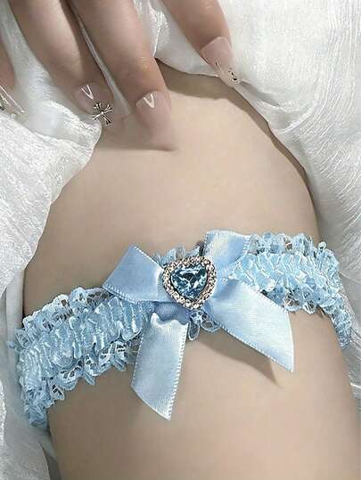 Liguero de boda elegante de encaje azul con lazo y decoración de corazón de cristal, liguero romántico de novia y dama de honor de encaje francés azul de moda y sexy para el Día de San Valentín