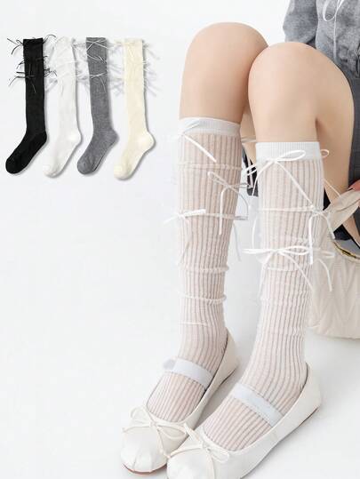 1双彩色女士过膝袜，细蝴蝶结装饰，适合春夏穿着，可搭配连衣裙等多种服饰。