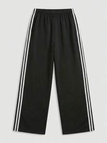 女士运动长裤，带口袋和松紧腰带，侧边饰有撞色条纹。运动休闲风格，适合所有季节。修身剪裁。是运动、户外活动和日常穿着的理想之选。黑色春季款 - 黑色 - 查看 4