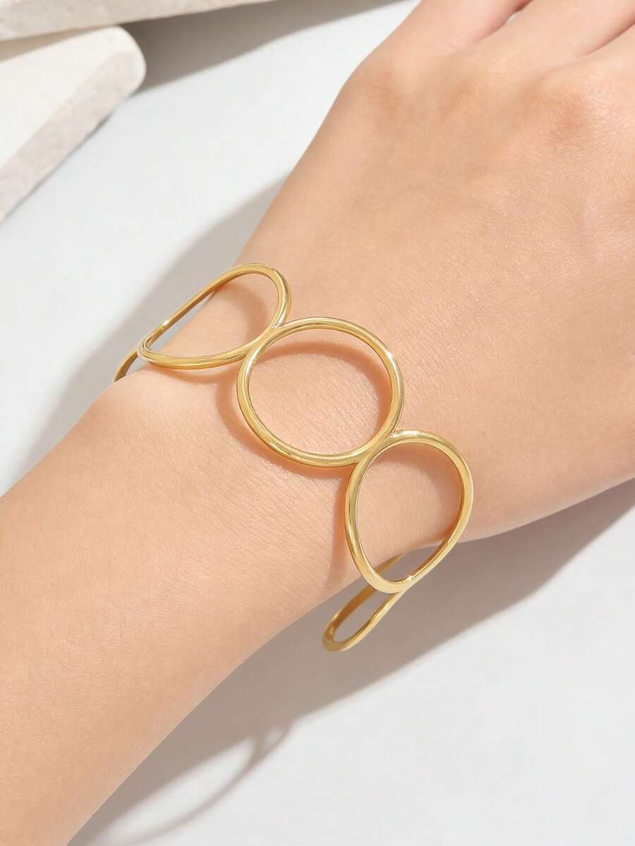 1 pieza Brazalete dorado de círculo hueco geométrico, brazalete de acero inoxidable de diseño único y sin decoloración - Pulsera redonda hueca - Ver 1