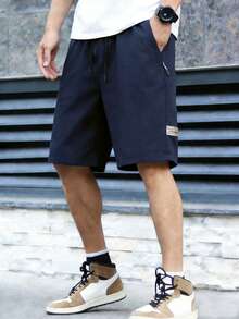 Quần short cargo nam kiểu dáng tối giản, quần ống đứng dài đến đầu gối có dây rút. - Màu xanh hải quân - Xem 8