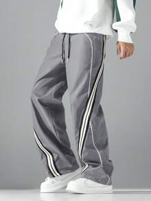 1 chiếc quần ống rộng dáng suông thời trang, có điểm nhấn là dải băng gân trang trí, thiết kế viền tương phản. Được làm từ vải polyester có độ bền cao, chống mài mòn, nhẹ và không nhăn, phù hợp cho các hoạt động ngoài trời thư giãn và thể thao thoải mái. Cạp quần co giãn giúp mặc thoải mái hơn. Một món quà đáng để thử. - Xám - Xem 7