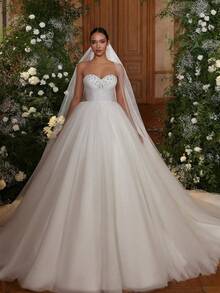 Strapless Backless A-Line Wedding Gown In Dreamy Organza – Enchanting Full-Length Bridal Dress With A Strapless Neckline And An Open Back, Crafted From Lightweight Organza. The Soft A-Line Skirt Creates A Flowing And Ethereal Look, Perfect For Weddings, Christmas Celebrations, Halloween Balls, Prom Events, Birthday Parties, And Formal Occasions. Designed For Ceremonies, Evening Soirees, Vacation Dinners, Sophisticated Gatherings, Reception Attire, Graduation Dances, Homecoming Festivities, Cocktail Parties, Bridesmaid Dressing, Wedding Guest Appearances, And Ceremonial Moments. - trắng - Xem 1