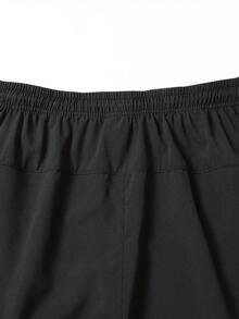 Pantalones cortos deportivos para hombres con cordón en la cintura y bolsillos laterales, adecuados para correr, baloncesto, fitness y otros deportes en color negro - Negro - Ver 4