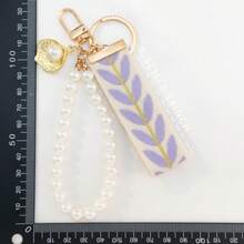 A Fashionable Keychain Adorned With Purple Woven Tape And Imitation Pearls - Mauve Purple - View 3