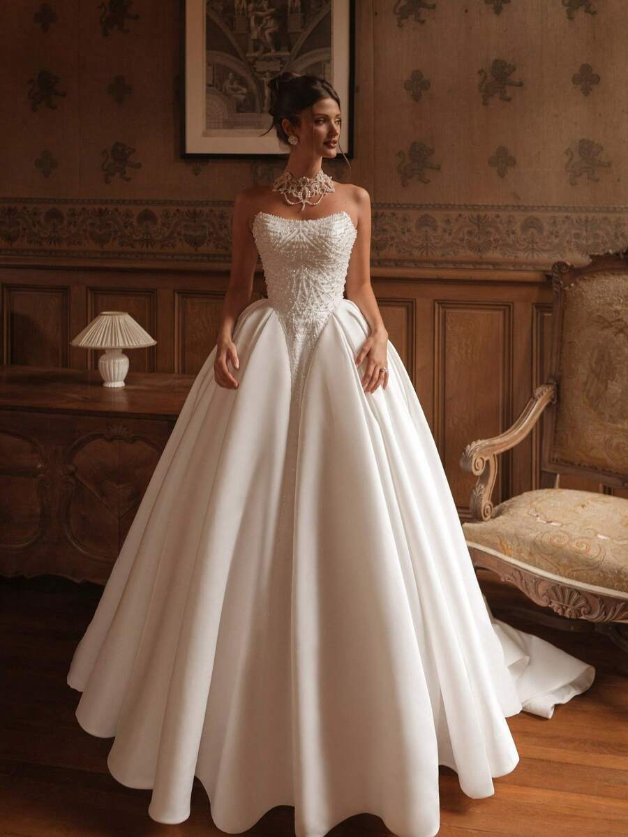 Elegant Strapless A-Line Wedding Dress With Chic Open Back In Satin – Sophisticated Floor-Length Bridal Gown Featuring A Flattering Corset-Style Bustier, Daring Rear Cutout, And Lustrous Satin Silhouette, Perfect For Weddings, Christmas Galas, Halloween Balls, Formal Dances, Birthday Celebrations, And Special Evening Events. A Versatile Choice For Wedding Receptions, Holiday Parties, Anniversary Dinners, Luxury Getaways, Black-Tie Occasions, Cocktail Gatherings, Bridal Showers, Wedding Guest Attire, Graduation Formals, Homecoming Events, And As A Modern Bridesmaid Or Festive Evening Gown. - 白色 - 查看 1