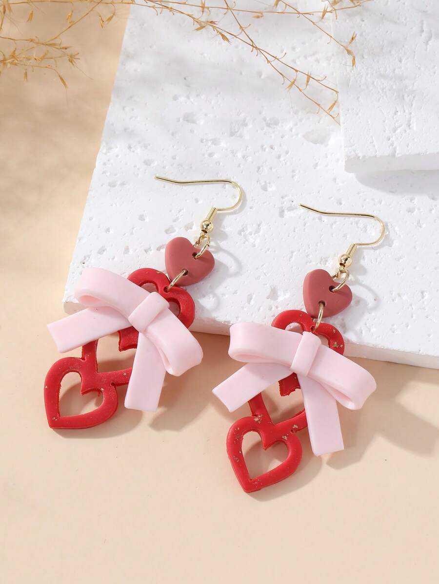 1对全新手工蝴蝶结镂空心形吊坠耳环，温柔浪漫的设计，适合约会、派对、度假等场合。
