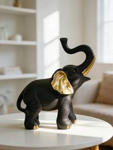 一件艺术树脂大象雕塑——时尚家居装饰，适用于桌面、壁炉架和书架。这款寓意吉祥的大象雕塑采用鲜艳的色彩对比和金色耳朵细节设计，能为您的家带来正能量。它适合摆放在卧室梳妆台、餐桌或接待区，兼具艺术性和寓意，是任何室内风格的点睛之笔。 - A - 查看 4