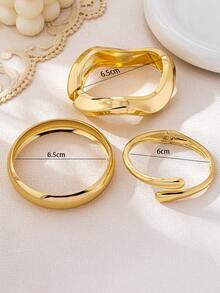 Bộ 3 vòng tay kiểu dáng tối giản mạ vàng, thiết kế bất đối xứng hình giọt nước, chất liệu dày dặn, bền chắc, làm từ kim loại nặng và hợp kim kẽm, thích hợp cho nữ giới. - Vàng - Xem 3