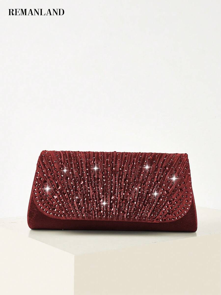 REMANLAND 这款奢华闪耀的手拿包饰有璀璨夺目的放射状水晶，散发着耀眼的光泽，造型经典永恒。它是出席正式舞会、盛大晚宴和红毯活动的完美之选，也是馈赠女性的最佳礼物。 - 酒紅色 - 查看 1