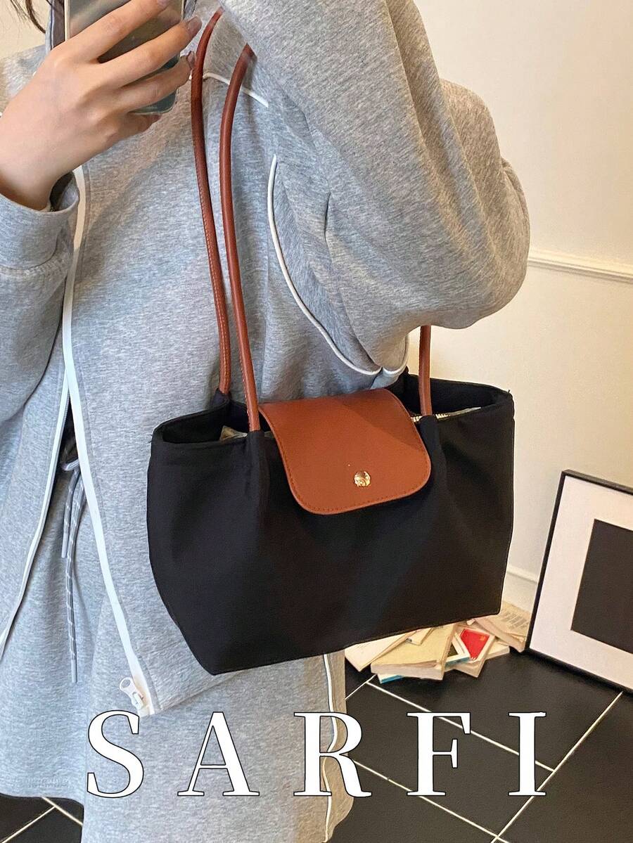 简约风格简约装饰设计女士单肩包，高端搭扣装饰休闲手提包，时尚褶皱设计轻便通勤包，适合大学生日常出行，轻便多功能通勤包，磁扣闭合，耐磨面料手提包，适合作为礼物送给朋友，也适合购物、约会、商务旅行、旅游和度假。