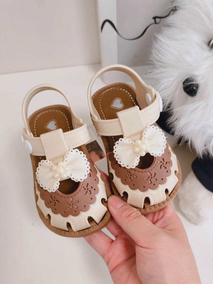1 Pair Toddler Cute Bow Decor Hook And Loop Design Soft Sole Comfortable Multipurpose Beach Sandals, Summer, Suitable For 0-3 Years Old Babies - Beige - View 1