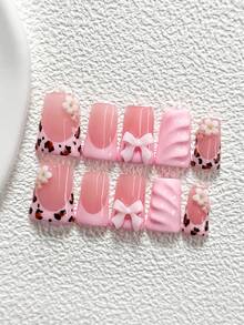 10片装粉色豹纹美甲凝胶套装，包含亚克力假指甲、粉色3D蝴蝶结、白色山茶花、手绘纯色水波纹、高品质粉色指甲油，以及美甲工具（1个果冻贴+1个指甲锉）。三种尺寸可选：杏仁形、鸭嘴形、棺材形。适合日常佩戴、派对、拍照、春夏通勤等场合，是送给女性和女孩的绝佳礼物。 - 彩色 - 查看 15