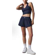 Pantalones cortos de tenis Grandstand para mujer de Alo Yoga | Tela ligera y de alto rendimiento | Corte holgado y transpirable | Pantalones deportivos cómodos de lujo para estudio y calle - Azul Marino - Ver 1