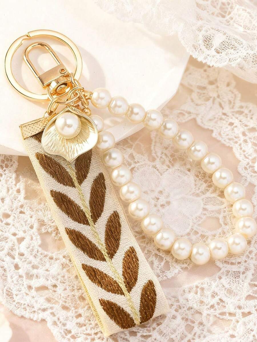 1 chiếc móc khóa thời trang trang trí ruy băng và ngọc trai giả, móc khóa xe hơi bằng vải dệt mới, phụ kiện hợp kim sáng tạo cho hộp đựng tai nghe và chìa khóa.