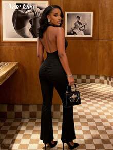 Bộ jumpsuit nữ gợi cảm cổ yếm màu đen cổ chữ V sâu, hở lưng, ống loe với chi tiết khóa kim loại và xếp ly, thích hợp cho tiệc tùng, đi club, dạo phố. - màu đen - Xem 2