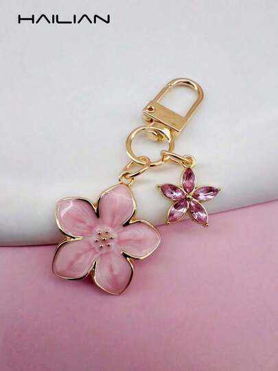 HAILIAN This Lightweight And Elegant Sakura-Shaped Keychain Is Made Of Alloy Material, Designed Specifically For Women, And Features A 5-Petal Small Flower As A Bag Charm.A Travel Accessory, It Can Be Used As A Bag Charm Or Car Key Chain, And Is Also An Ideal Gift Choice For Couples' Birthdays And Holidays.