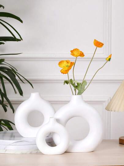 1 chiếc bình hoa hình bánh donut kiểu hiện đại, đồ trang trí nhà cửa cao cấp bằng nhựa, màu vàng, trắng, đen.