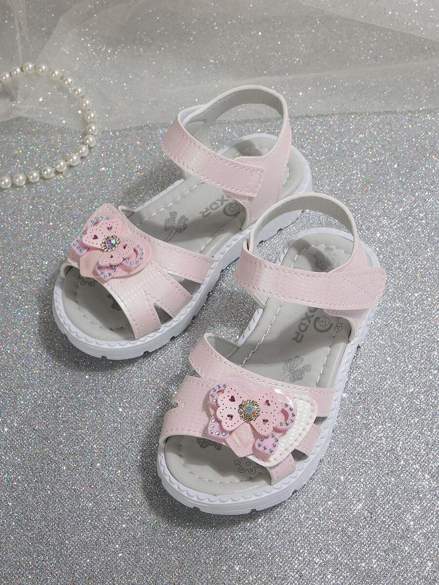 1 đôi dép xăng đan trẻ em, phù hợp cho bé gái, kiểu dáng mùa hè mới, thời trang thường ngày, mũi tròn, đế mềm, đính đá hình bướm, dép xăng đan đế bằng, giày công chúa cho bé, mẫu năm 2026. - Màu Hồng baby - Xem 1