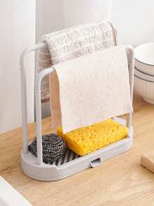 Este estante de almacenamiento para fregadero de cocina es una caja de almacenamiento para encimera que ahorra espacio con una bandeja de drenaje. Es un contenedor de almacenamiento compacto para el fregadero con un diseño de drenaje rápido y una instalación fácil sin necesidad de taladrar. Adecuado para almacenar artículos de cocina y baño como paños de cocina, esponjas, cepillos y jabón. También es adecuado para almacenar esponjas, paños de cocina, fregonas, cepillos, lana de acero y otros artículos de almacenamiento de cocina. Forma parte de un estante y soporte de almacenamiento de cocina. - Ver 3