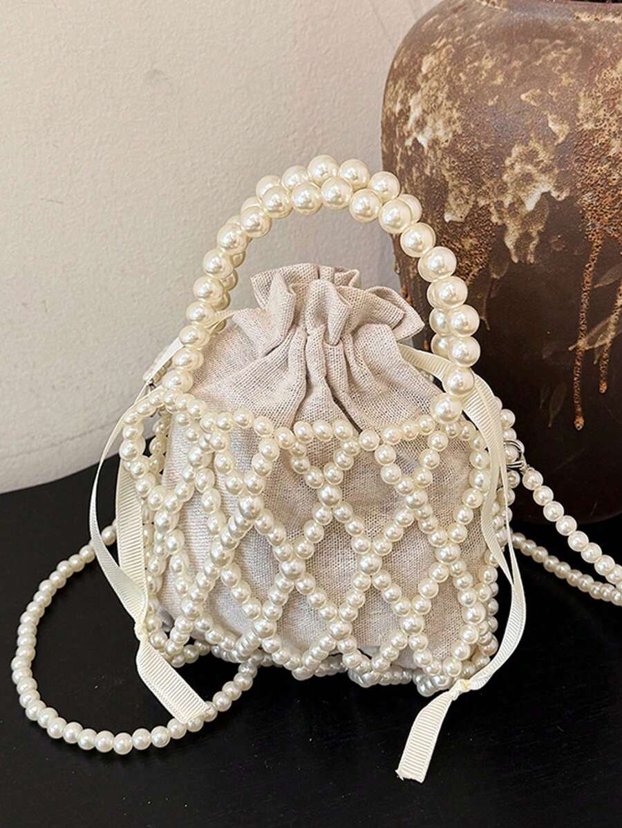 法式优雅女士珍珠手提包，手工串珠单肩斜挎包，夏季手机水桶小包，小众设计菱形镂空珍珠包