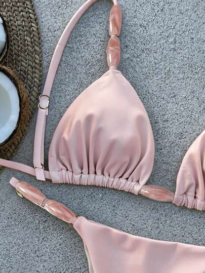 Bikinx 女士优雅比基尼套装，采用细肩带、系带前襟和露背设计，并饰有打结细节，尽显时尚风采。