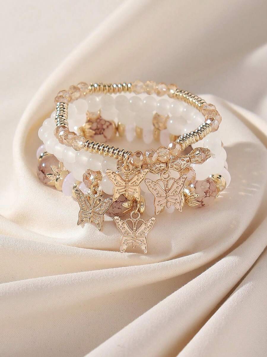 Bộ 4 chiếc vòng tay co giãn thủ công kiểu Bohemian đính cườm hình hoa và bướm dành cho nữ, phong cách nghỉ mát biển, vị trí mặt dây chuyền hình bướm ngẫu nhiên.