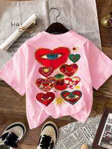 Camisas de mujer,blusa,ropa de mujer,blusas bonitas,blusas para dama,blusas casuales para dama,blusas elegantes dama juvenil,Playera de mujer cuello redondo manga corta verano refrescante estilo casual,con estampado llamativo de corazones y ojos,detalles étnicos y vibrantes,Tela de algodón 100% transpirable y absorbente de sudor,Tacto suave, resistente y no fácil de deformar,Corte holgado oversize cómodo sin restricciones,estilo bohemio y juvenil,estampado vibrante con aire latino,tufo visual intenso,ideal para paseos,playa,uso doméstico o comutación,versátil y apta para regalar - Rosa - Ver 4
