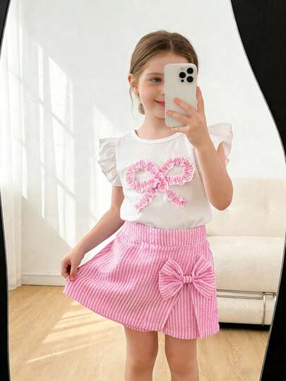 Conjunto de 2 piezas de camiseta de manga acampanada blanca + falda pantalón a rayas azul y blanco para niñas de 4 a 7 años, con decoración de lazo, estilo europeo fresco y dulce, de tela de gasa de burbujas transpirable, conjunto de vacaciones de verano 2026 para niñas pequeñas