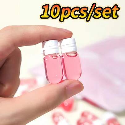 10个迷你玻璃旅行可灌装瓶，带防漏翻盖，透明便携式翻盖迷你瓶，用于精确测量液体、储存和整理小物件 - 便携式胶囊形容器，适用于护肤品、卸妆液等。