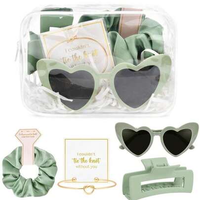 5件套新娘派对用品套装，包括透明化妆包、装饰眼镜、发夹、发圈、打结手链，是送给新娘、伴娘、婚礼、单身派对和婚礼配饰的完美礼物。