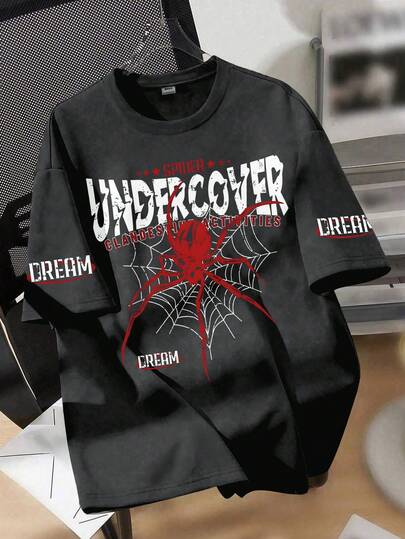 青少年男童街头风宽松T恤，蜘蛛图案及“UNDERCOVER”标语印花，“DREAM”点缀，超大短袖上衣，适合朋友聚会、周末休闲、街头风、日常穿着。