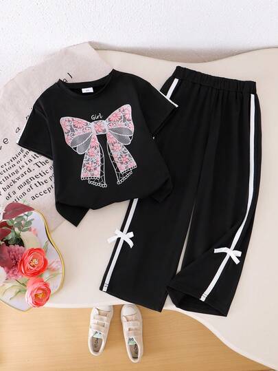 Conjunto de 2 piezas de top de manga corta con cuello redondo y pantalón con lazo, con estampado floral y de moño, para niñas, de estilo casual de verano