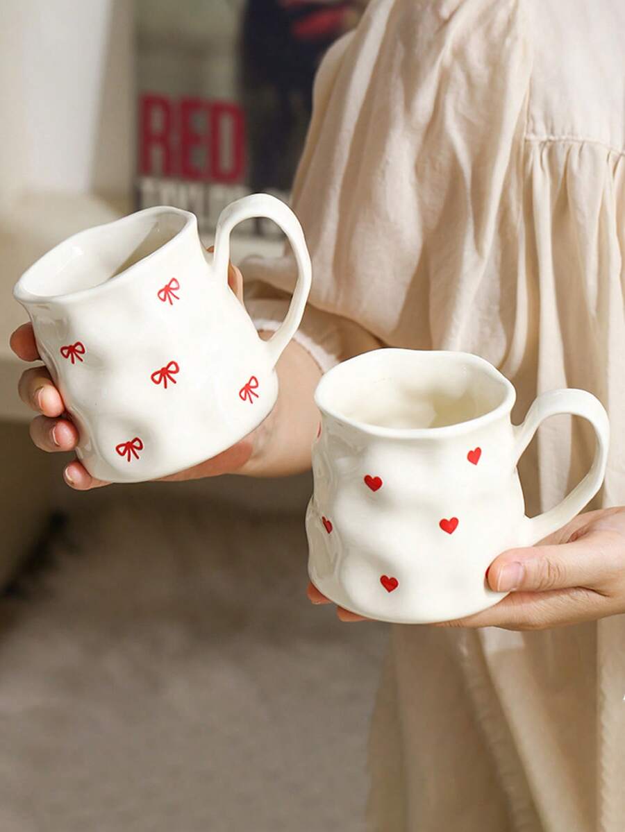 1pc Creative Cute Ceramic Cup, Hand-Painted Heart & Bow Pattern, Asymmetrical Cup Body, Office & Casual Mug, Home Breakfast Cup, Afternoon Tea Lovely Drinkware, Practical Ceramic Ware