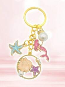 15 piezas/5 sets Llaveros con tema oceánico de estrellas de mar y sirena con perlas, incluye 5 llaveros, 5 tarjetas de agradecimiento y 5 bolsas de organza. Excelente para decorar mochilas, autos y suministros para fiestas DIY. - Multicolor - Ver 7