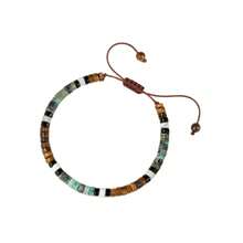 这款男女皆宜的可调节能量手链采用天然虎眼石、绿松石和白纹石珠手工制作而成。这些具有疗愈功效的水晶珠子能够舒展心灵，是馈赠佳品。 - 虎眼+白松 - 查看 6