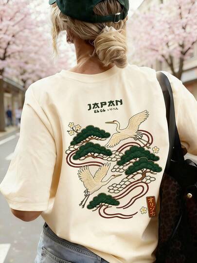 夏季新款休闲宽松黑色短袖T恤，饰以简约双天鹅飞翔印花，适合日常及度假穿着。